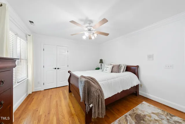 an aerial view of residential house with outdoor space and trees all around