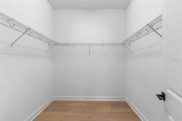 a bathroom with a shower sink and mirror