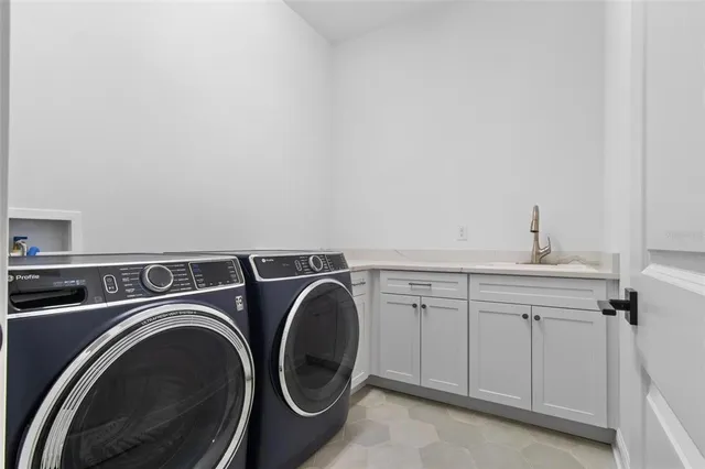a bathroom with a sink double vanity and a mirror