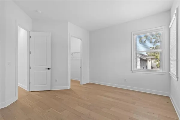a bathroom with a toilet and a tub