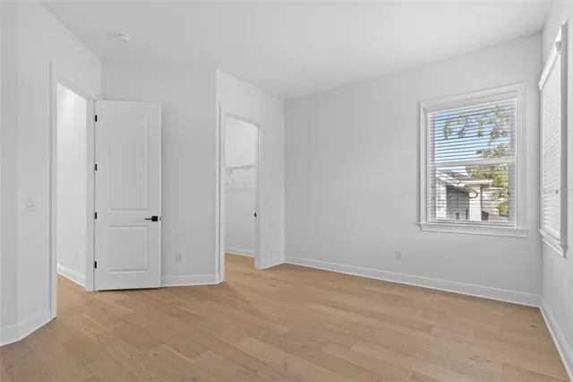 a bathroom with a toilet and a tub