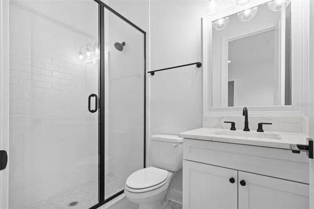 a view of a house with backyard and a tree