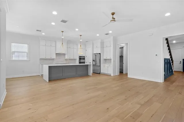 a large kitchen with cabinets
