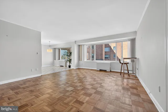 a view of an empty room with a window