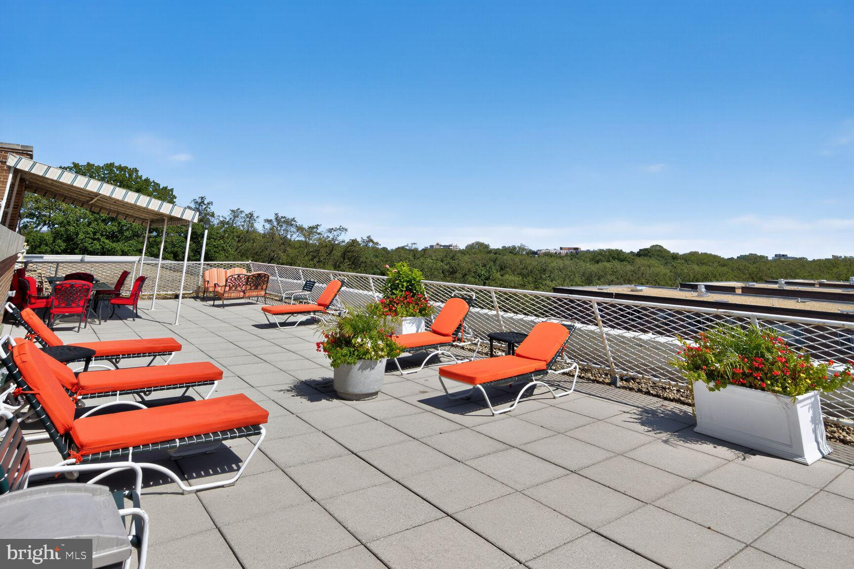 4301 Massachusetts Avenue Northwest, Unit 6014 Washington, DC 20016 - Photo 19 of 22 an outdoor living space with furniture and city view