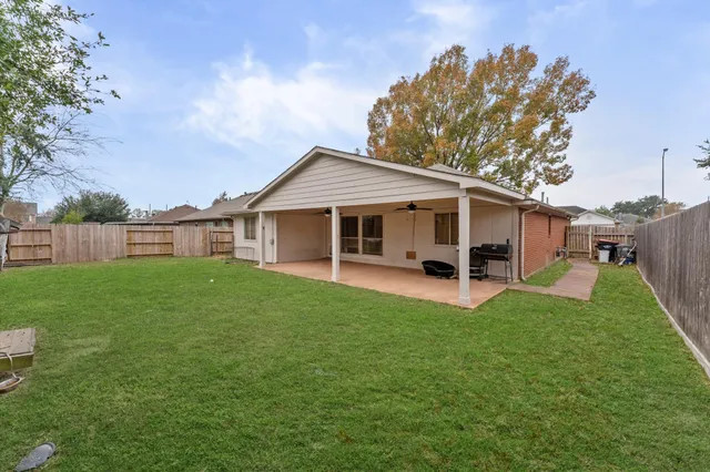 a front view of a house with a garden and deck