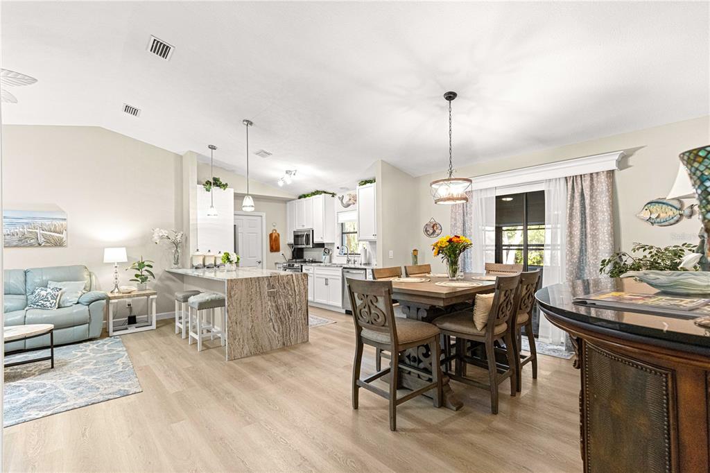 1155 East Bismark Street Hernando, FL 34442 - Photo 12 of 52 a view of a dining room with furniture window and wooden floor