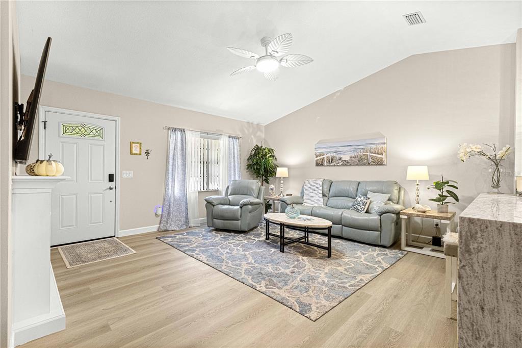 1155 East Bismark Street Hernando, FL 34442 - Photo 17 of 52 a living room with furniture and a large window