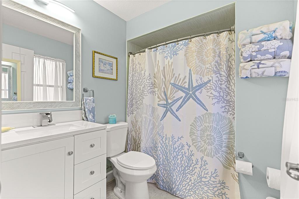 1155 East Bismark Street Hernando, FL 34442 - Photo 30 of 52 a bathroom with a sink toilet and shower