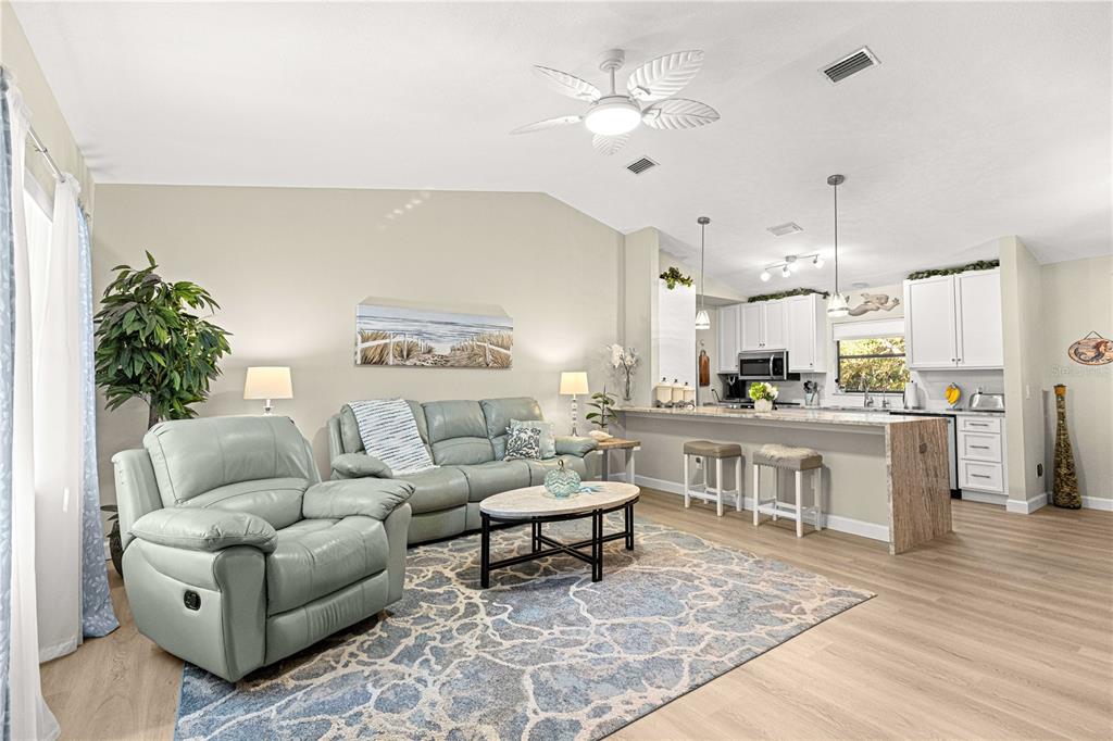 1155 East Bismark Street Hernando, FL 34442 - Photo 3 of 52 a living room with furniture and kitchen view