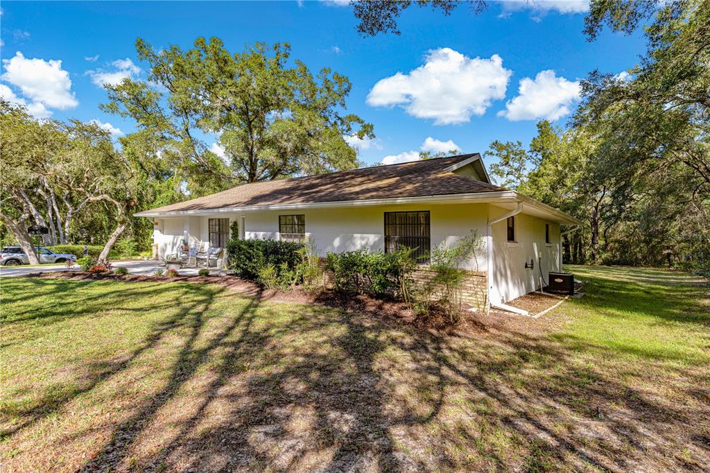 1155 East Bismark Street Hernando, FL 34442 - Photo 35 of 52 a view of a house with backyard and sitting area