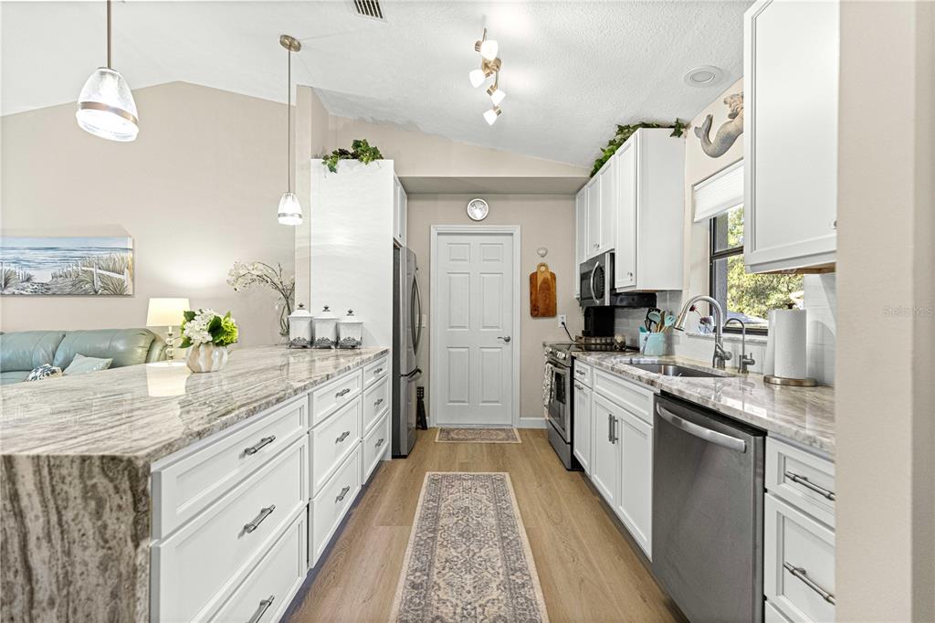 1155 East Bismark Street Hernando, FL 34442 - Photo 7 of 52 a large kitchen with a lot of counter space