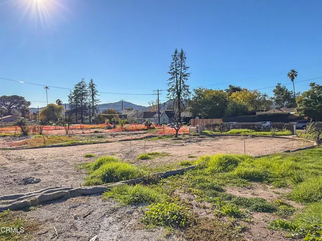 a view of a swimming pool with an outdoor seating