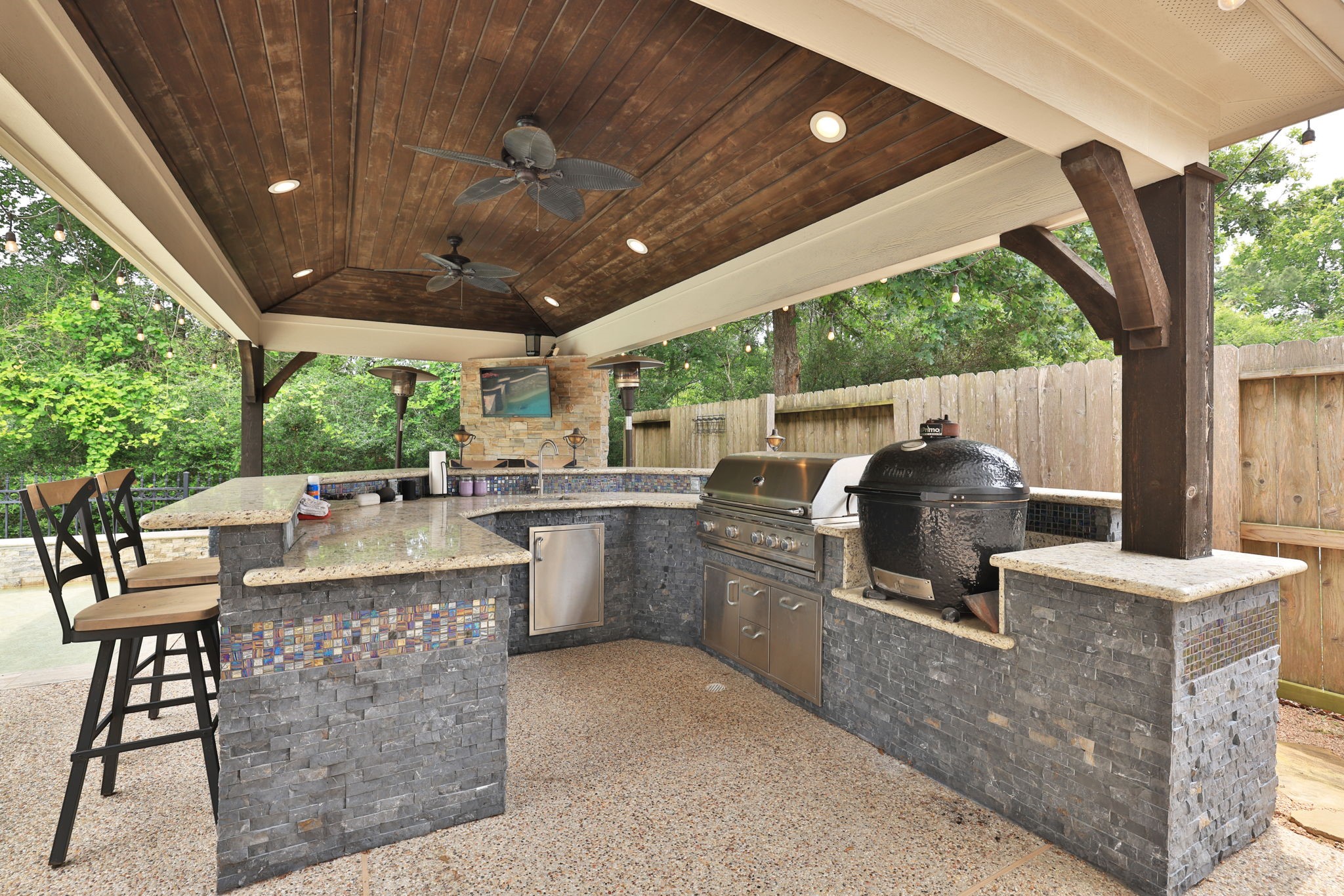 1214 Eversham Way Kingwood, TX 77339 - Photo 5 of 50 Fabulous outdoor kitchen with gas grill and Primo grill
