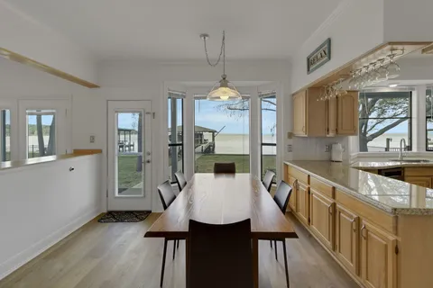 a kitchen with stainless steel appliances a sink stove and cabinets