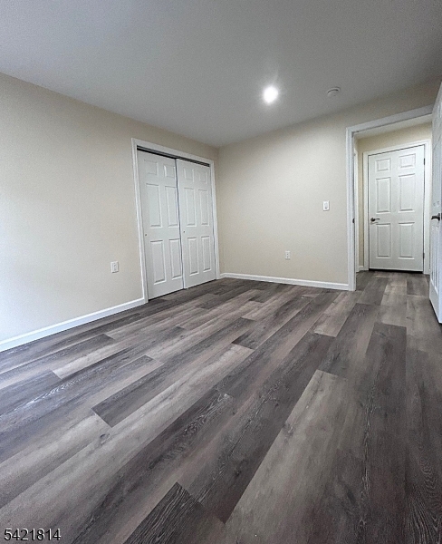 22 Cross Street Union, NJ 07088 - Photo 9 of 14 an empty room with wooden floor and windows