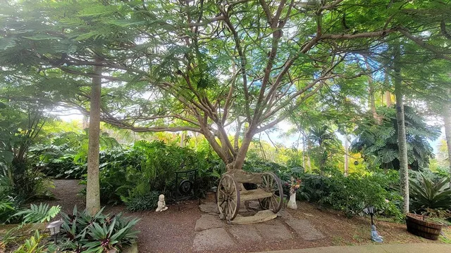 a backyard of a house with a yard and outdoor seating