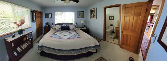 a view of a porch with chairs and backyard