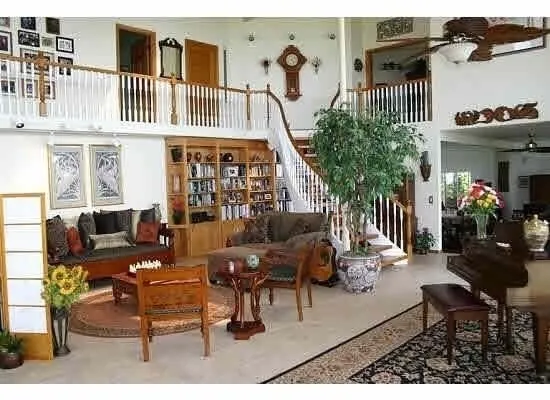 a hallway with table and chairs
