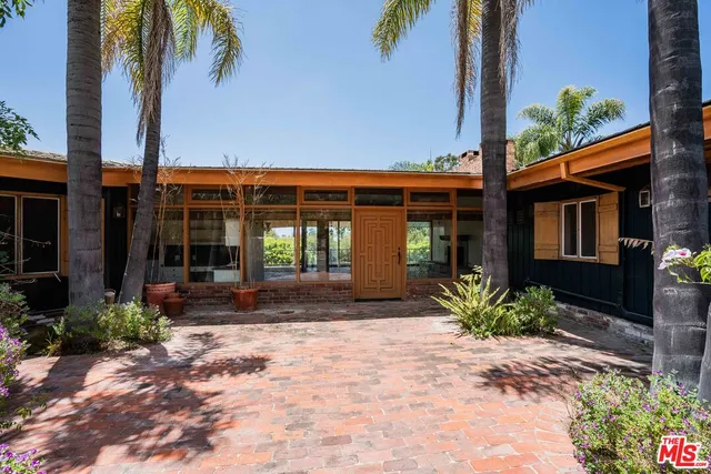 a front view of a house with a porch