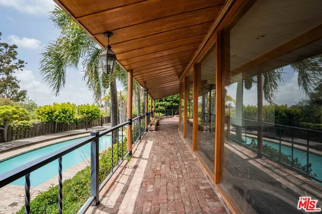 a view of a balcony with wooden floor