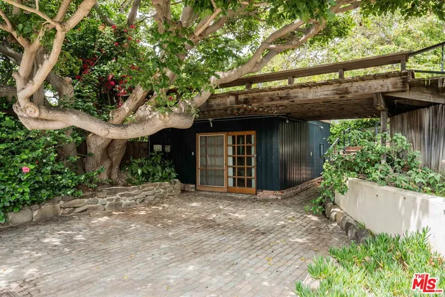 a view of a house with a tree