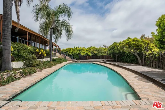 a view of swimming pool from a balcony