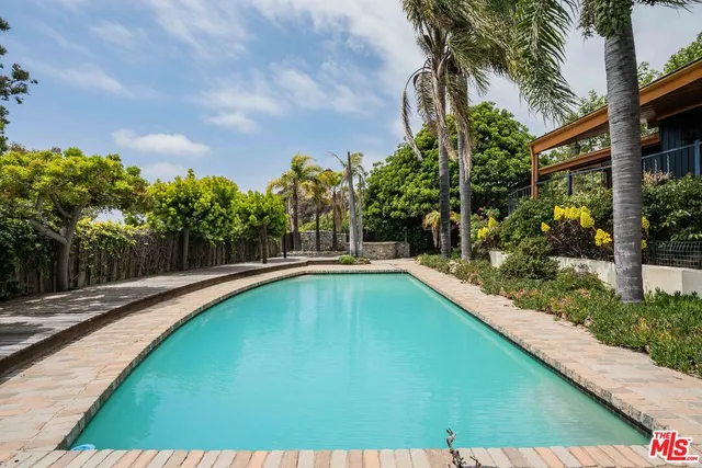 a view of swimming pool from a balcony