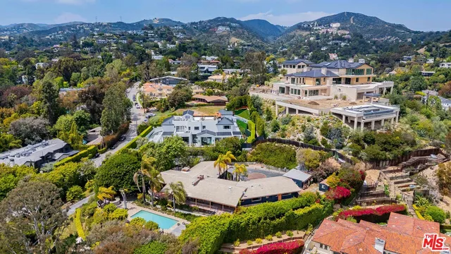 an aerial view of residential houses and outdoor space