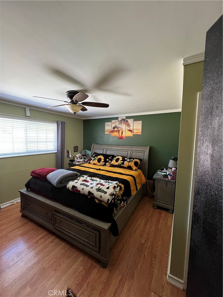 646 Boulder Street Fillmore, CA 93015 - Photo 8 of 10 a bed sitting in a bedroom next to a window