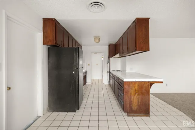 a kitchen with stainless steel appliances granite countertop a sink and a stove