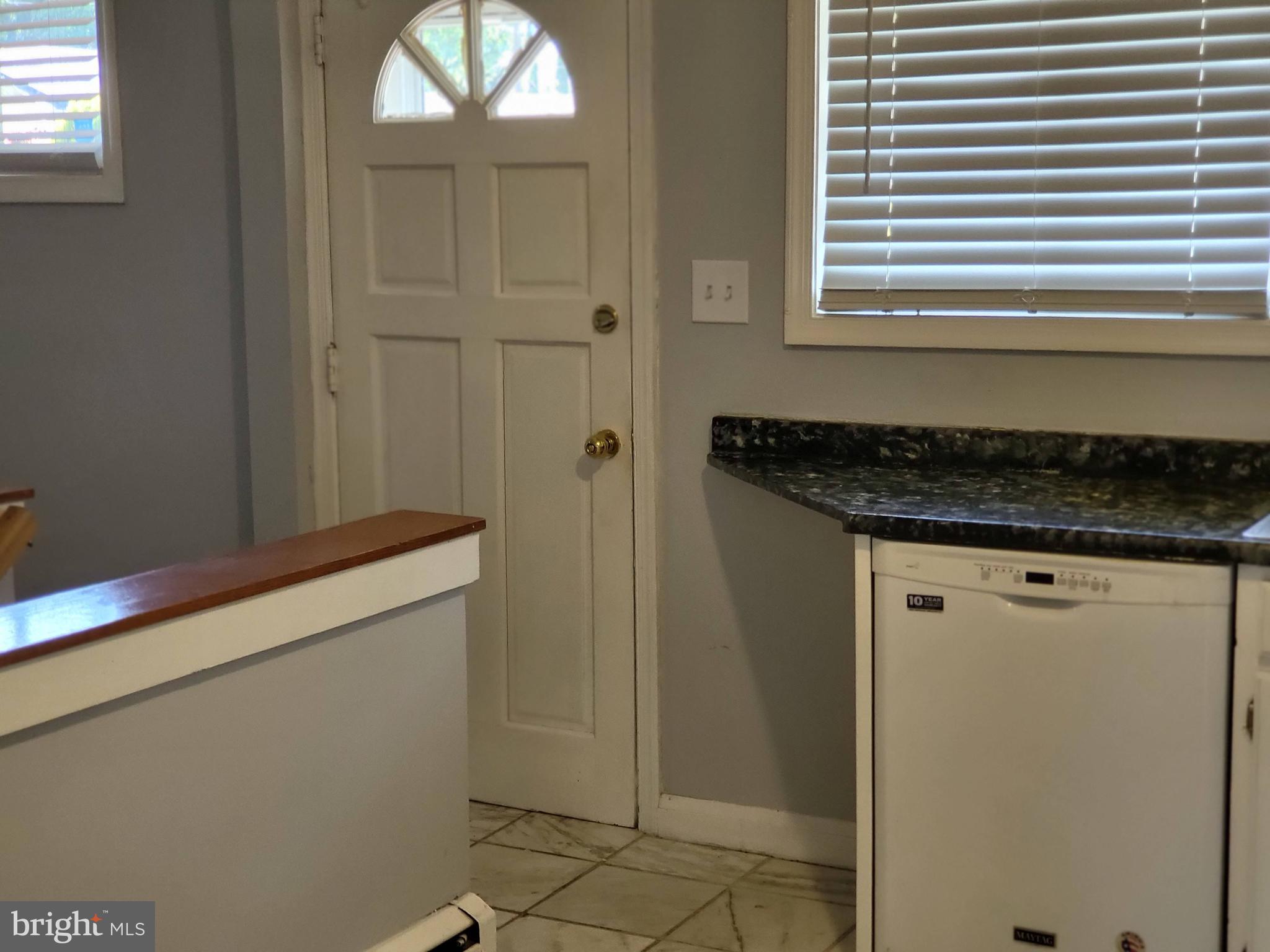 8600 Dovedale Road Randallstown, MD 21133 - Photo 9 of 20 Back door to deck off kitchen