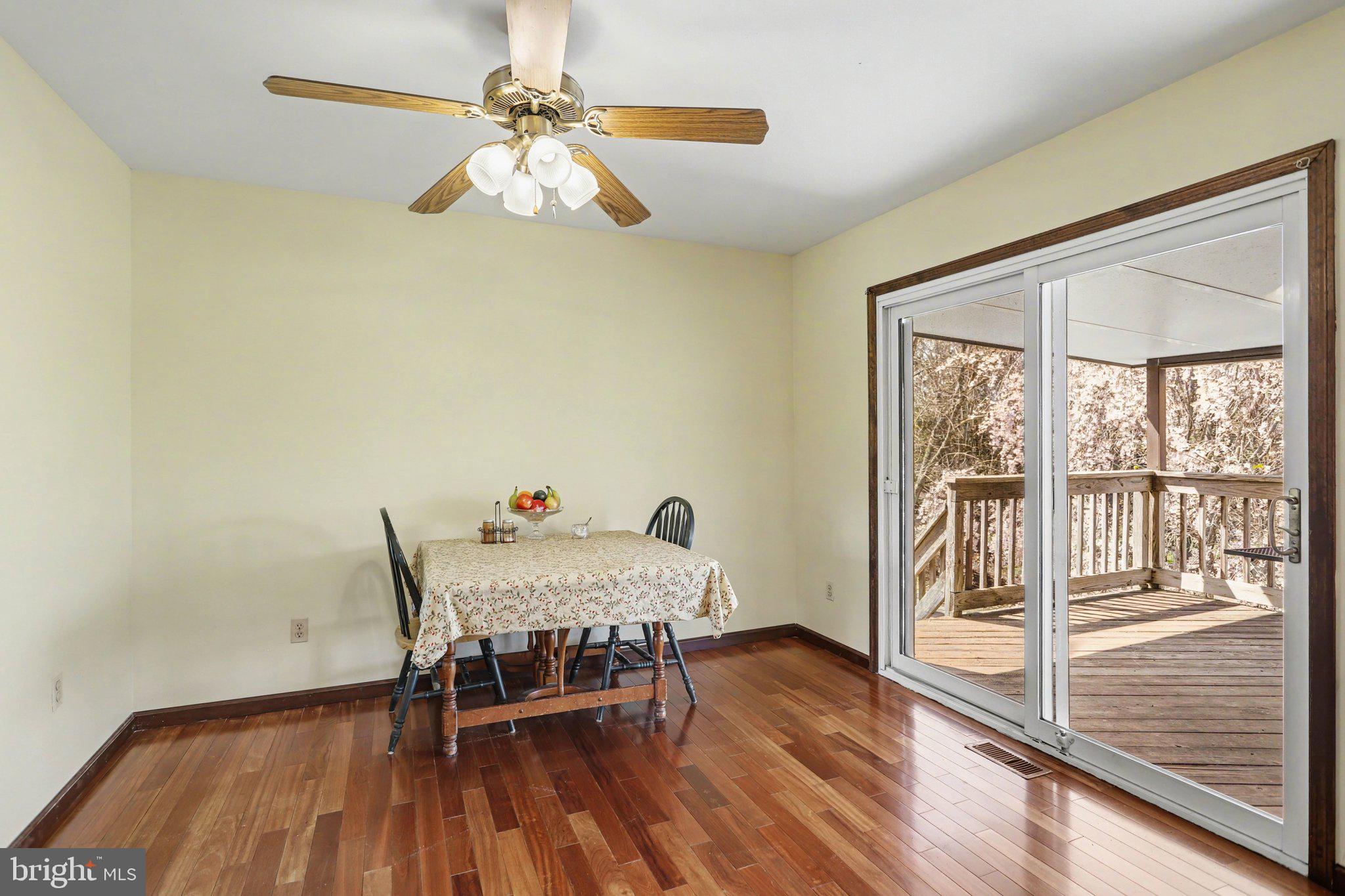 5007 Snyder Mill Road Spring Grove, PA 17362 - Photo 11 of 33 a dining room with furniture and wooden floor