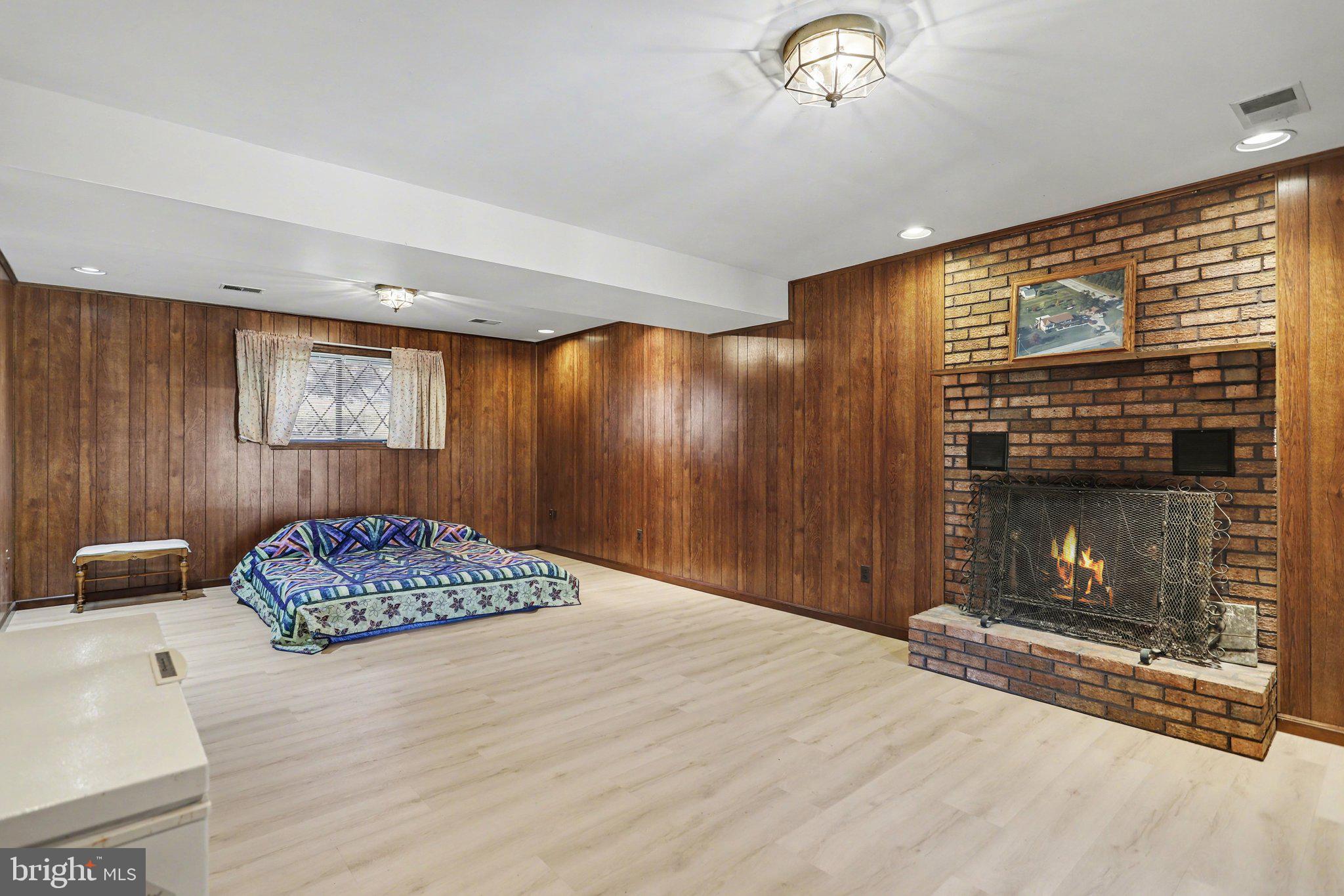 5007 Snyder Mill Road Spring Grove, PA 17362 - Photo 20 of 33 a bedroom with a bed and a fireplace