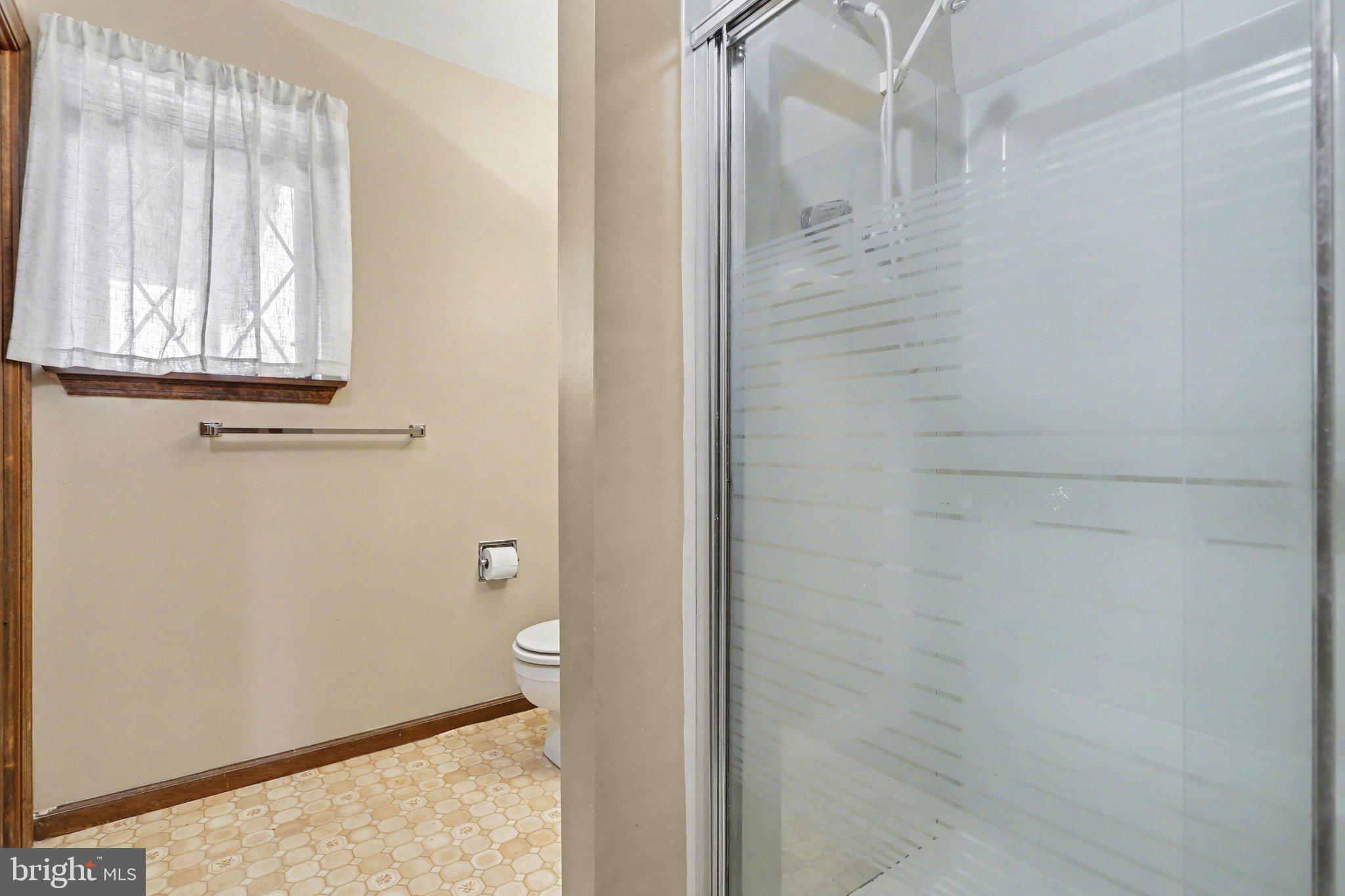 5007 Snyder Mill Road Spring Grove, PA 17362 - Photo 25 of 33 a bathroom with a granite countertop window and a shower