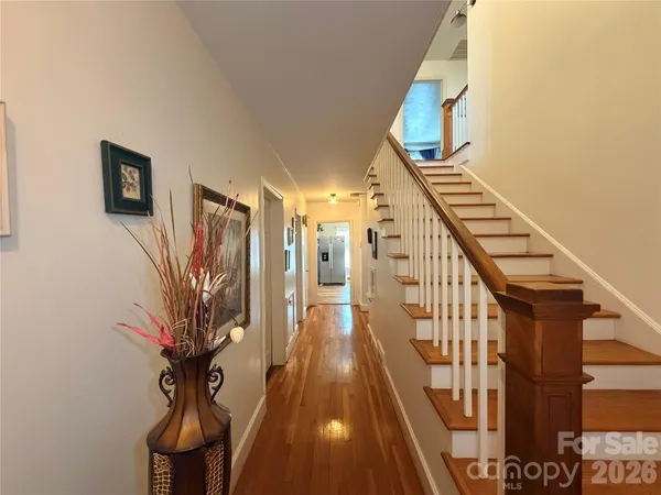 a view of entryway with wooden floor