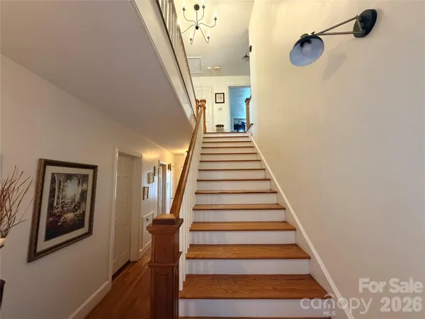 a view of a hallway with staircase