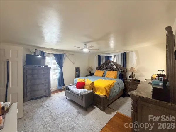 a bed room with a bed and a couch