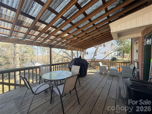 a view of a chairs and table in the balcony