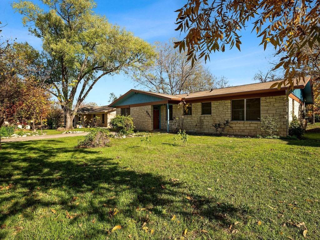 5811 Eureka Drive Austin, TX 78745 - Photo 1 of 1 a front view of house with yard and green space