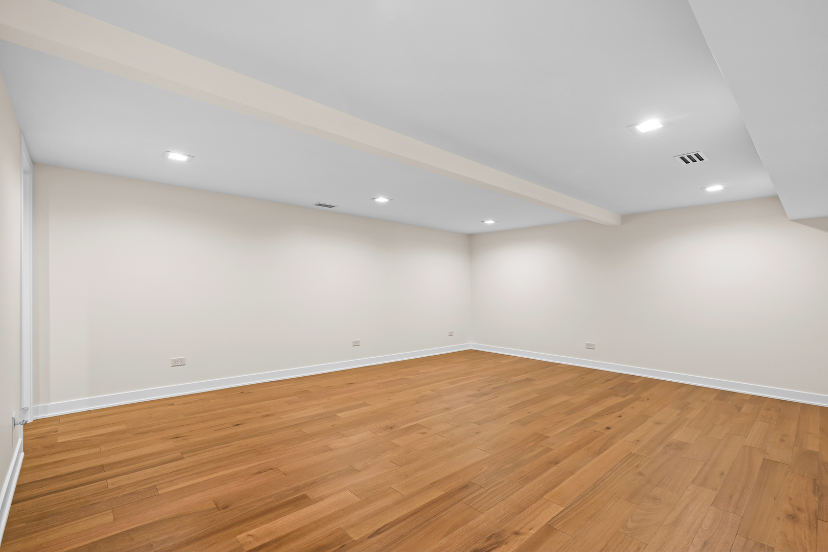 830 Deerfield Road Highland Park, IL 60035 - Photo 14 of 40 an empty room with wooden floor and windows