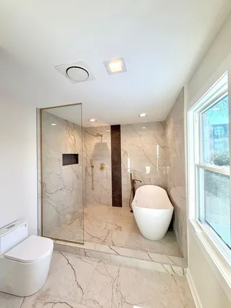 a bathroom with a mirror and a shower
