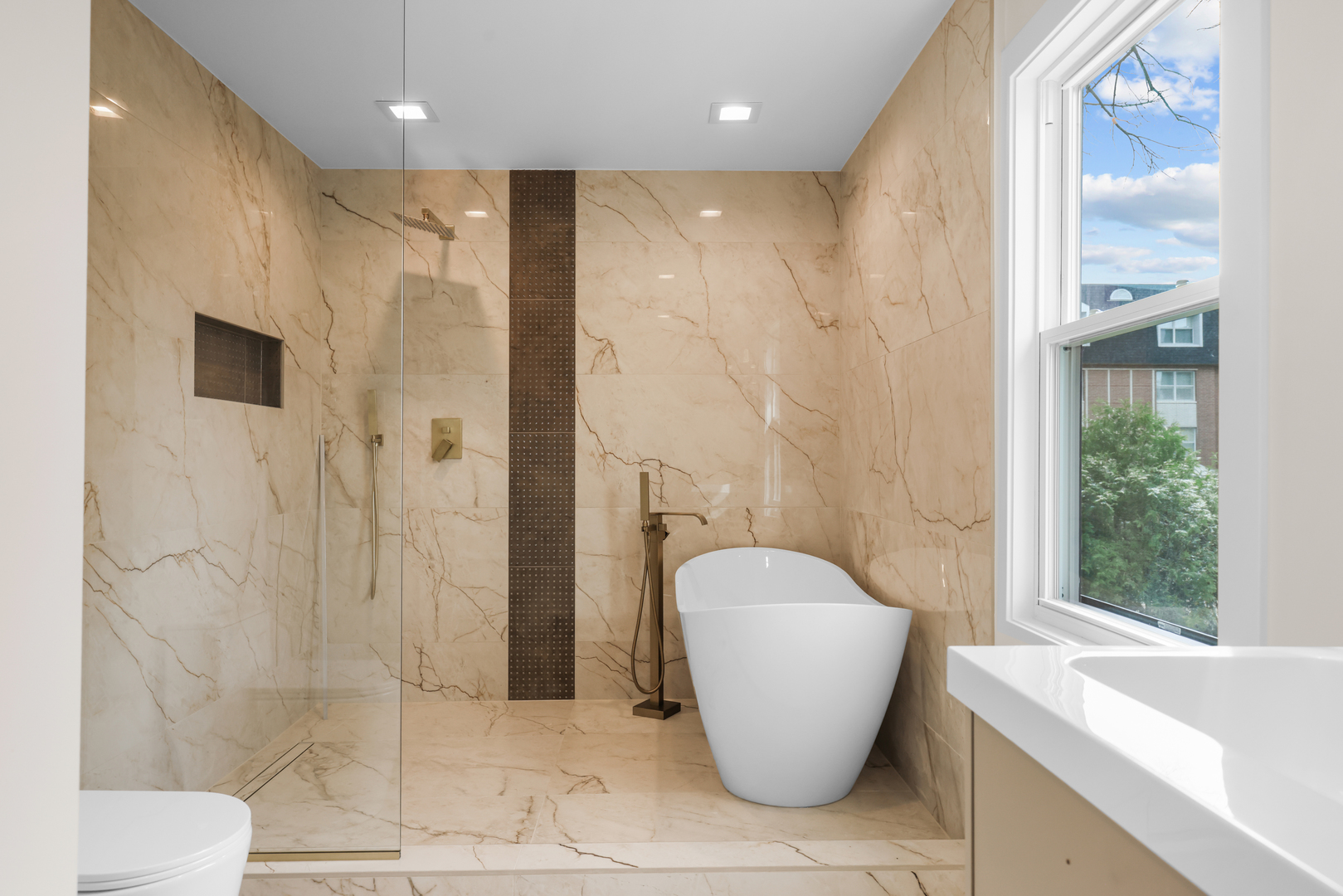 830 Deerfield Road Highland Park, IL 60035 - Photo 17 of 40 a bathroom with a granite countertop sink a toilet and shower