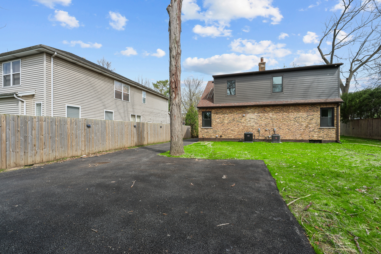 830 Deerfield Road Highland Park, IL 60035 - Photo 2 of 40 a front view of a house with a yard and garage