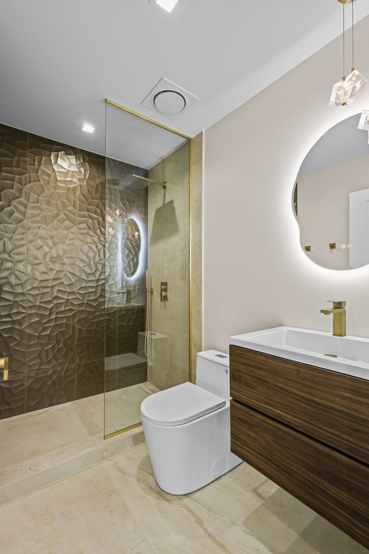 830 Deerfield Road Highland Park, IL 60035 - Photo 25 of 40 a bathroom with a sink a toilet and shower