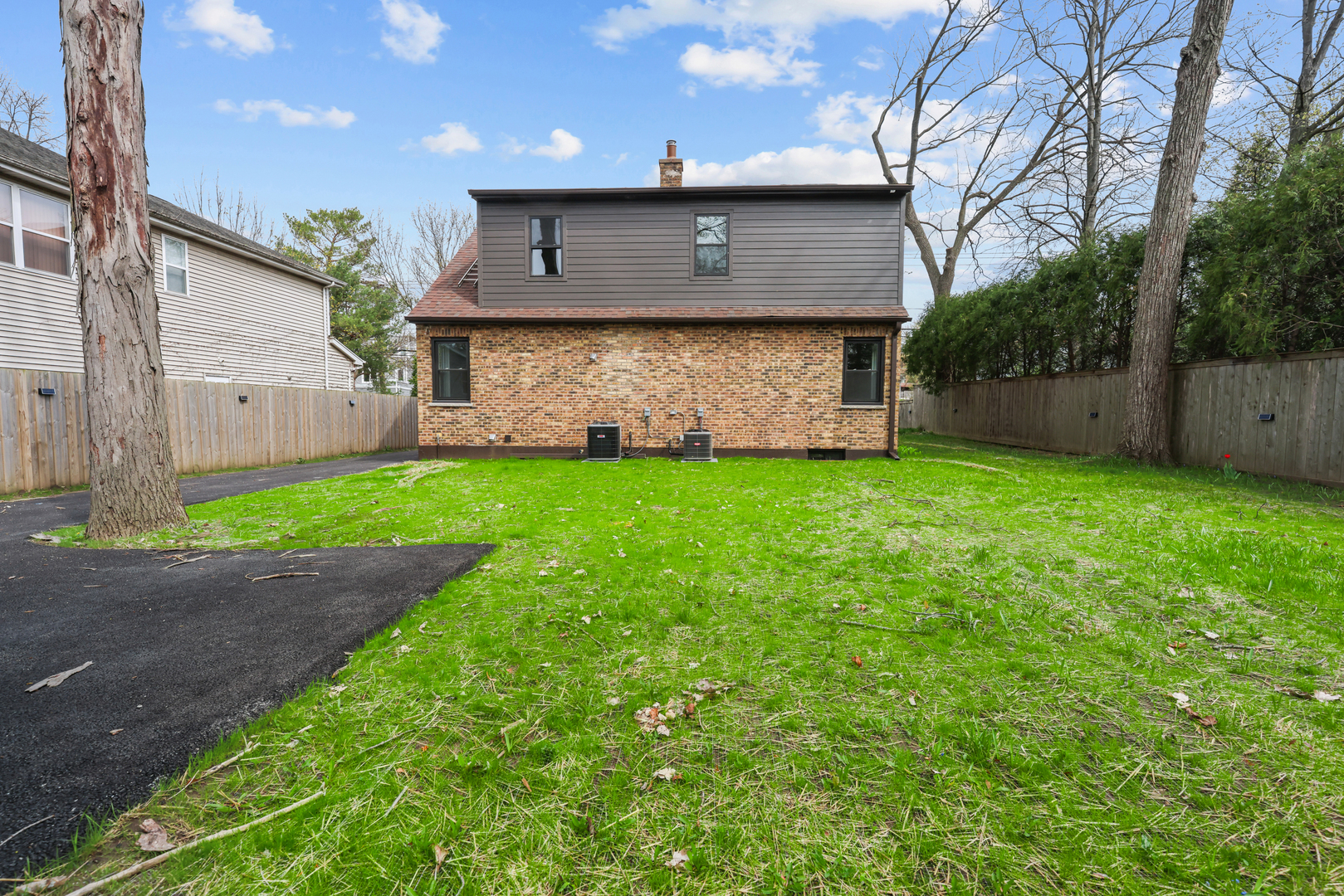 830 Deerfield Road Highland Park, IL 60035 - Photo 3 of 40 a front view of a house with a yard and garage