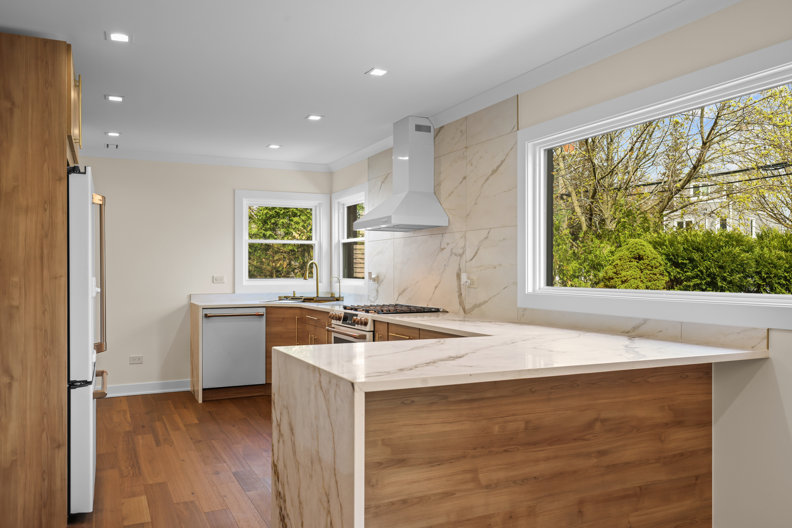 830 Deerfield Road Highland Park, IL 60035 - Photo 32 of 40 a kitchen that has a sink a stove and a wooden floor