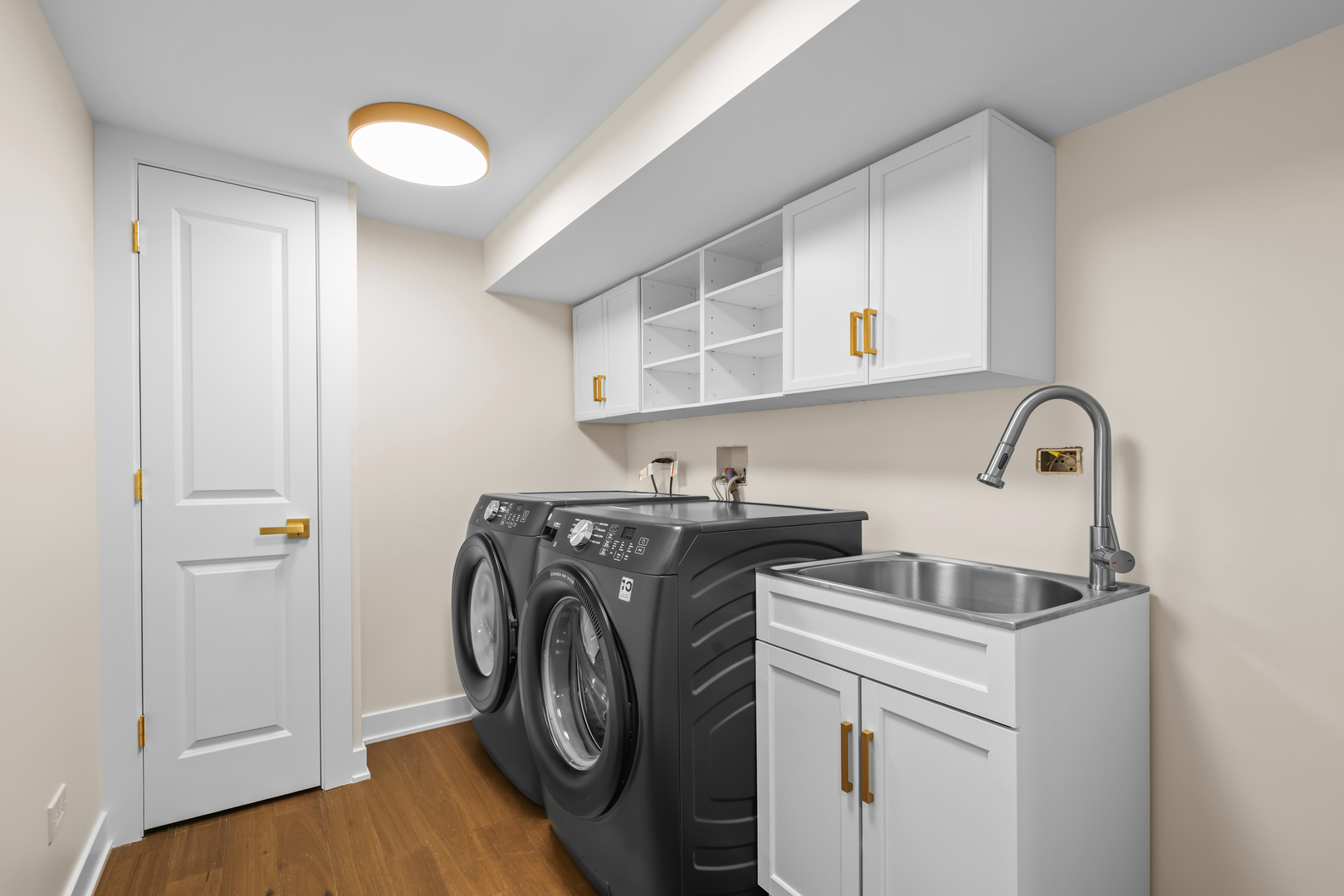 830 Deerfield Road Highland Park, IL 60035 - Photo 7 of 40 a utility room with sink dryer and washer