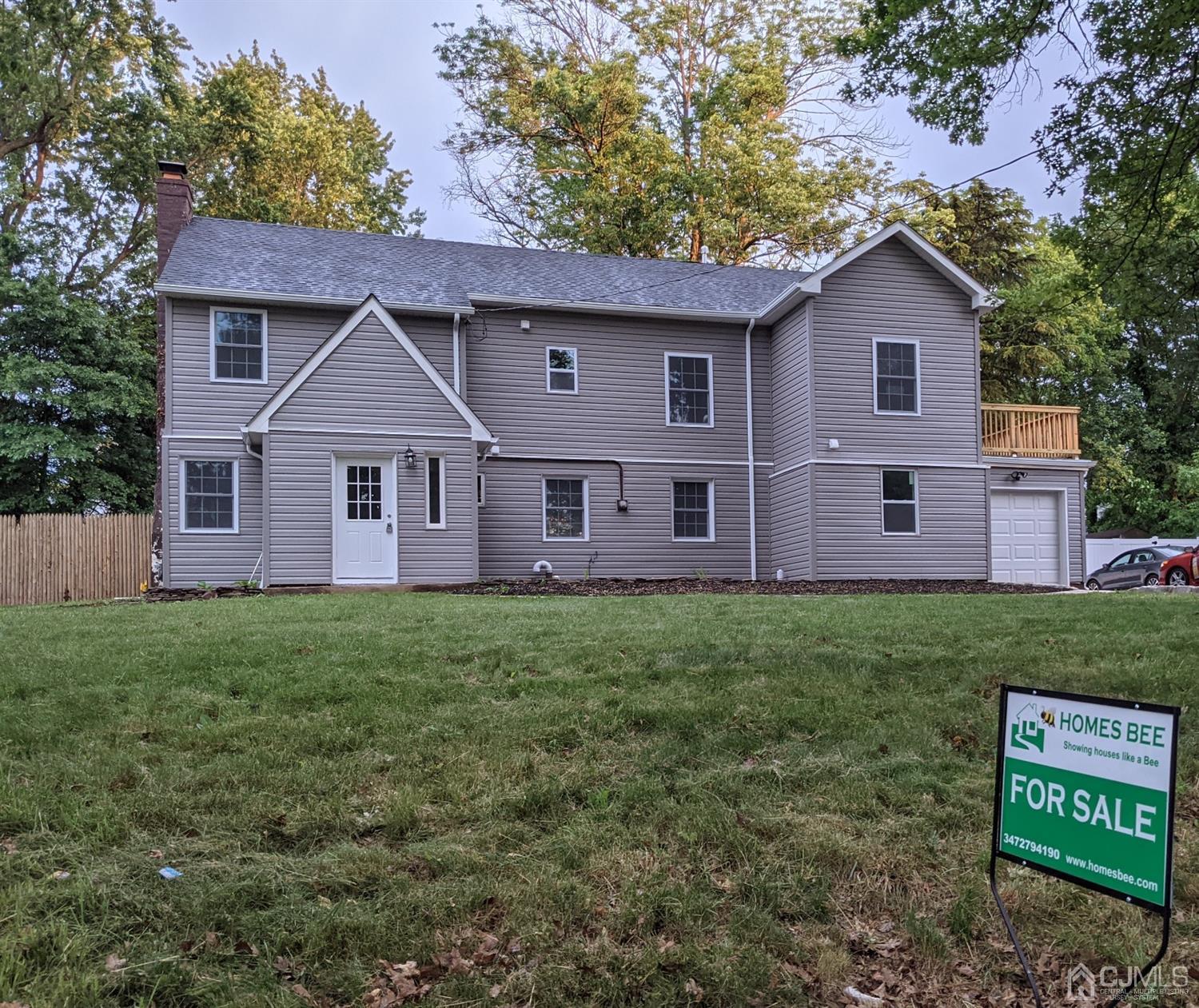 429 Chain O' Hills Road Colonia, NJ 07067 - Photo 1 of 44 a front view of a house with a garden