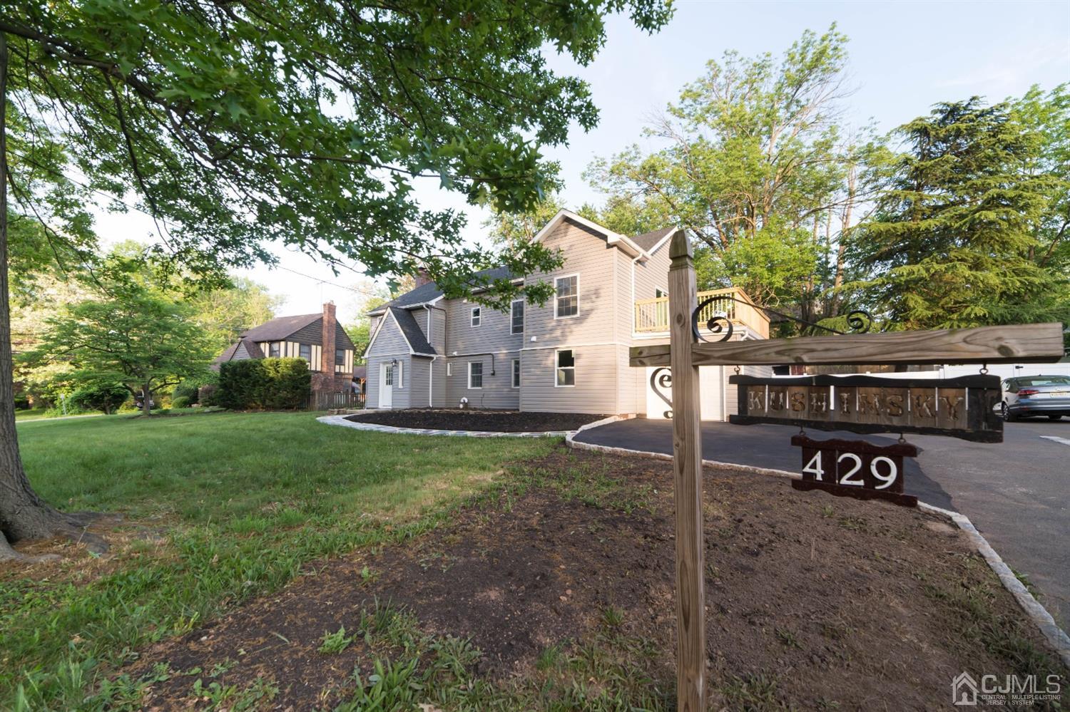 429 Chain O' Hills Road Colonia, NJ 07067 - Photo 3 of 44 a view of a house with backyard and a tree